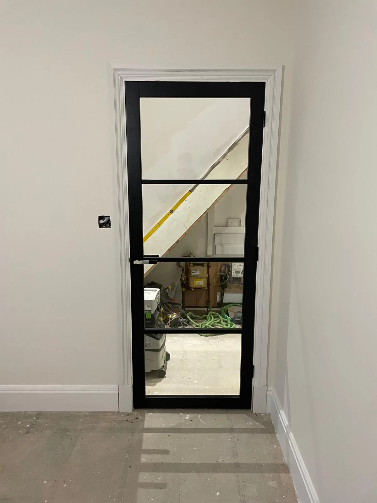 Black framed internal door installation by RT Carpentry